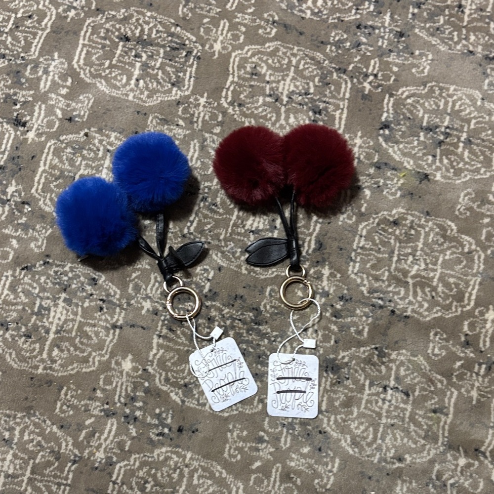 Free People Faux Fur Pom Pom Keychain Duo in Royal Blue & Wine